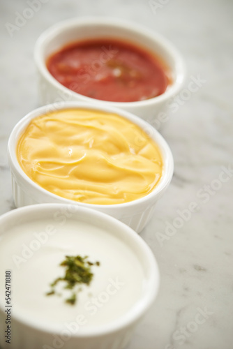 Mustard sauce and various sauces in a small bowl
