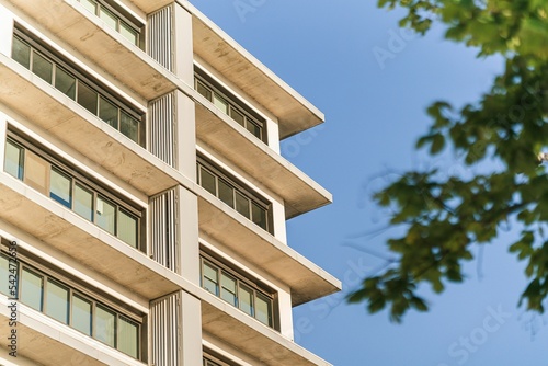 Low-angle view of a building's exterior under the blue sky