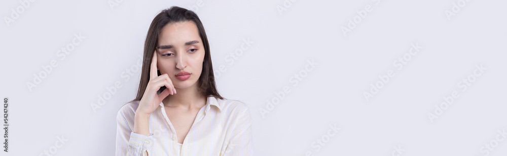 Portrait of a beautiful young woman thinking, isolated on white background Portrait of a beautiful young woman thinking, isolated on white background