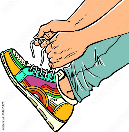 A teenager puts on sneakers, close-up, bright sports youth urban shoes
