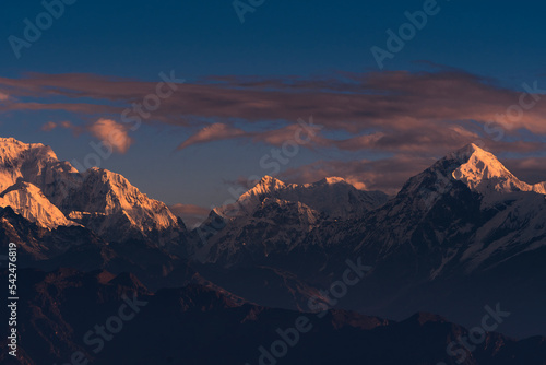 First ray of morning sun on the peaks of majestic Kangchenjunga range (third highest in the World) of Himalayas. Photo taken from Sandakphu, West Bengal.