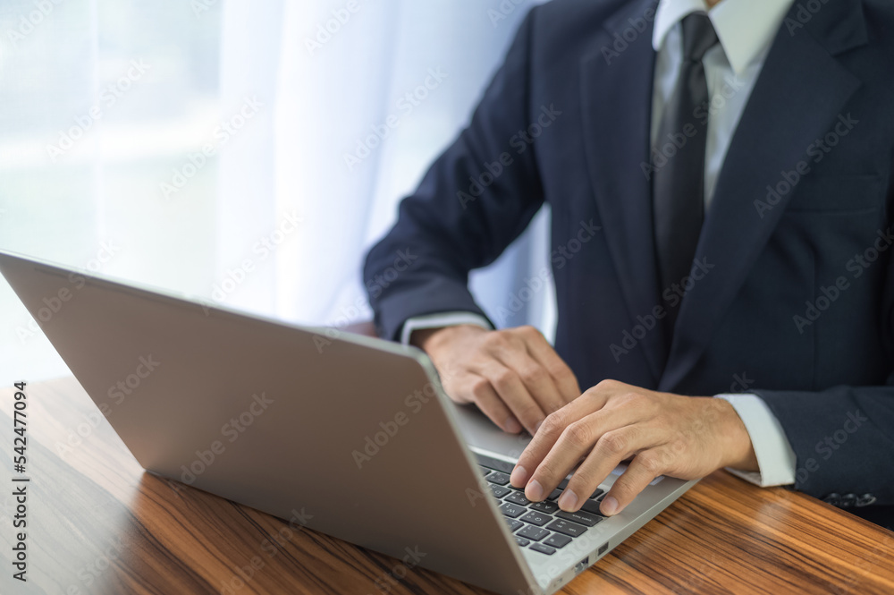 Business man using computer working in office Business man using computer working in office