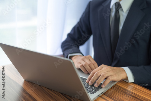 Business man using computer working in office © Suriyo