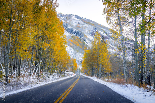 Aspen, Colorado Maroon Bells creek road in Rocky Mountains in October late fall autumn foliage season with trees forest in snow and yellow leaves © Kristina Blokhin