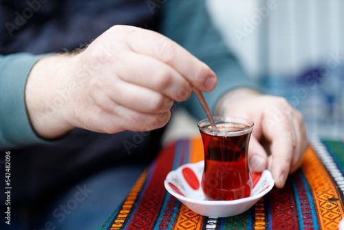 Traditional Turkish tea that is drunk near a cafe on the market street of Istanbul