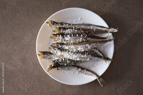 Salted fresh smelt on a plate photo