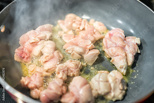 Macro closeup of fresh whole beef sweetbreads thymus organ gland, nutritious ancestral meat homemade food cooking frying on pan with steam