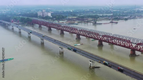 Meghna Bridge, Ashuganj, Bangladesh.
Aerial view of Syed Nazrul Islam Bridge and two rail way bridges cross the Meghna River from Bhairab Bazar to Ashuganj. Bangladesh. photo