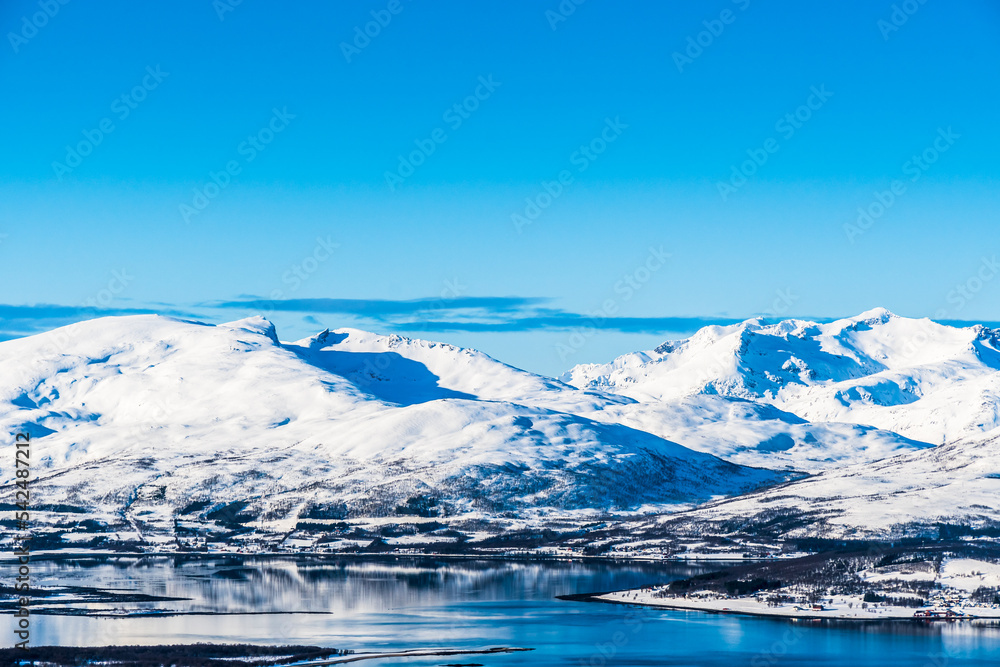 View from Mount Storsteinen on the Norwegian mountains around the city of Tromso