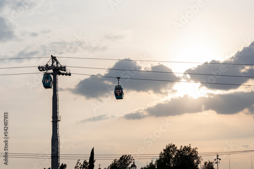 Tower with two teleferico or cablebus cabins in Mexico City with the sky in the background photo