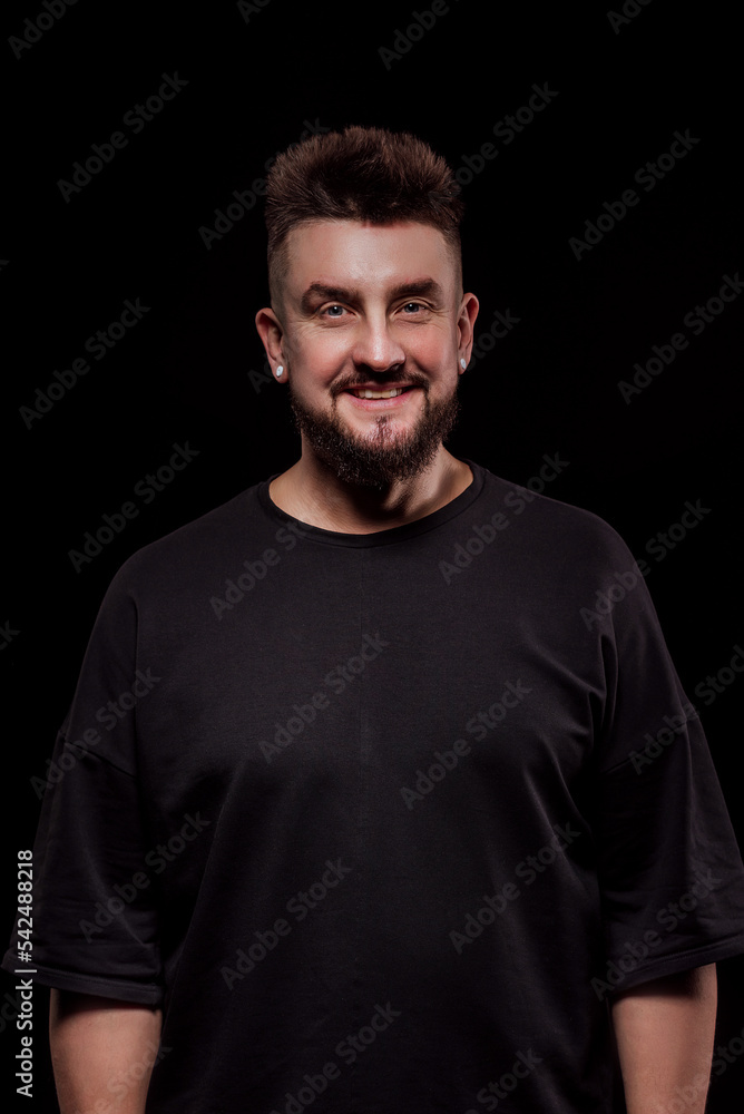 portrait of a man in the studio on a black background portrait of a man in the studio on a black background