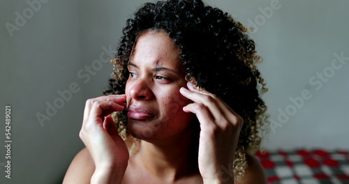 Crying hispanic woman feeling sad and hopeless