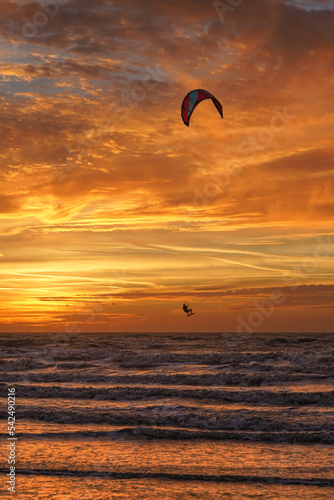 Photography kite surfing at sunset