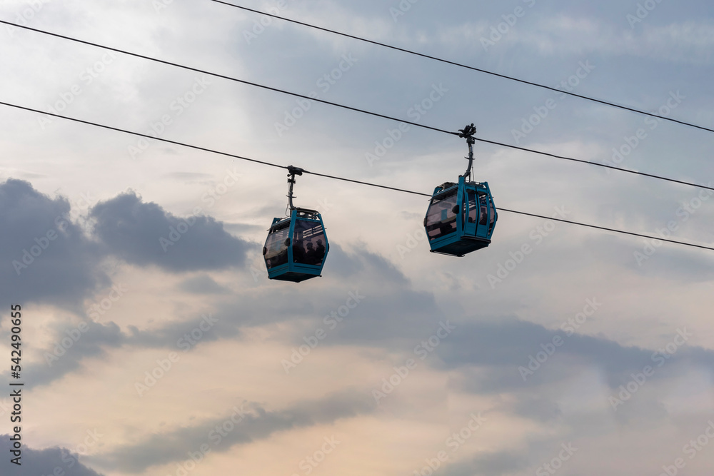 Two cablebus or teleferico cabins in Mexico City with the sky in the background Two cablebus or teleferico cabins in Mexico City with the sky in the background