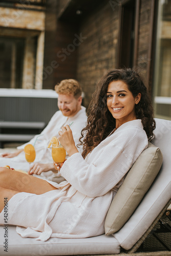 Young couple relaxing on be...