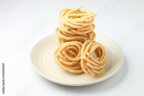 Murukku is a savoury snack popular in south India and Sri Lanka. murukku also known as chakli south indian traditional vegetarian snack photo