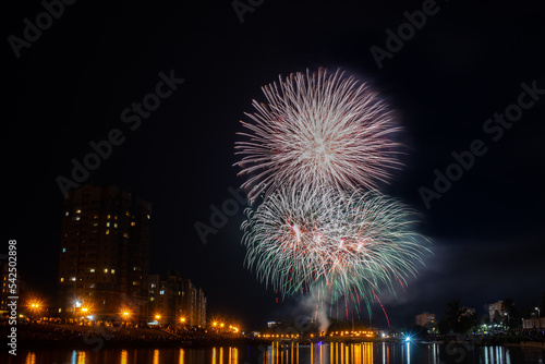 fireworks over the river in the city
