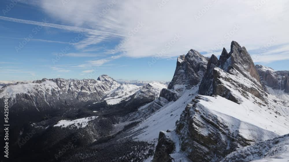 Time-lapse of snow-capped Seceda mountain in the Italian Dolomites with blue sky and clouds flowing through the sky. Video beautiful scenery of snowy mountains in motion. Time-lapse of snow-capped Seceda mountain in the Italian Dolomites with blue sky and clouds flowing through the sky. Video beautiful scenery of snowy mountains in motion.