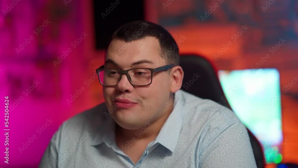 The gamer plays at the computer and eats a burger and pizza. A Thick programmer writes code and eats a burger and pizza. The gamer plays at the computer and eats a burger and pizza. A Thick programmer writes code and eats a burger and pizza.