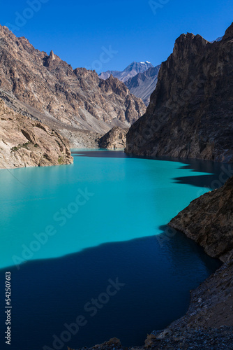 Fototapeta Naklejka Na Ścianę i Meble -  Turquoise water of Attabad lake around mountains in Northern Pakistan, formed through a Land Slide in 2010. Hunza Nagar, Gilgit-Baltistan, Pakistan