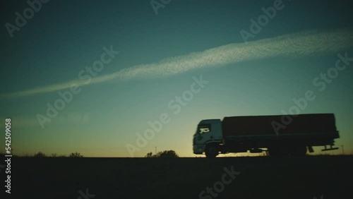 establishing side shot of the road with a truck and a car passing by at brazil