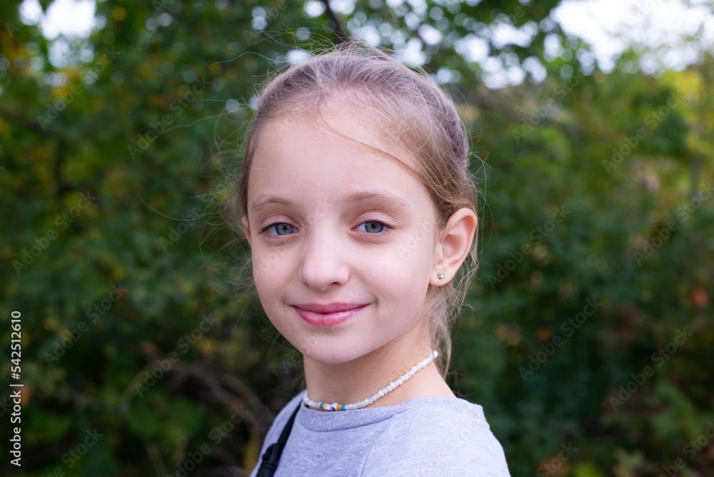 A European girl smiles sweetly. Beautiful girl is happy. Summer A European girl smiles sweetly. Beautiful girl is happy. Summer