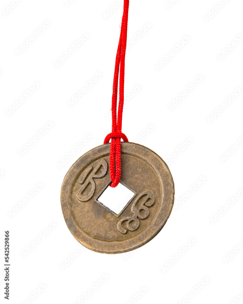 Chinese lucky old coin with red tape isolated on the white Chinese lucky old coin with red tape isolated on the white