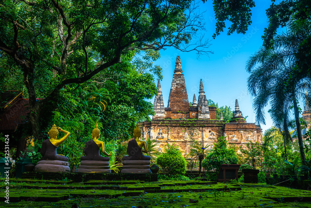 Naklejka premium Wat Chet Yot or Wat Photharam Maha Wihan, seven pagoda temple It is a major tourist attraction in Chiang Mai, Thailand.with evening,Temple in Chiang Mai.