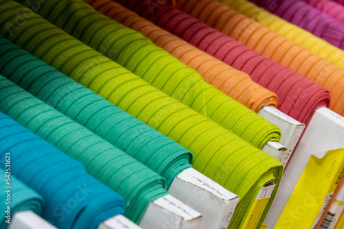 bolts of colored fabric