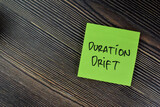 Concept of Duration Drift write on sticky notes isolated on Wooden Table.