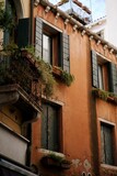 Vertical shot of a house with an old facade and plants