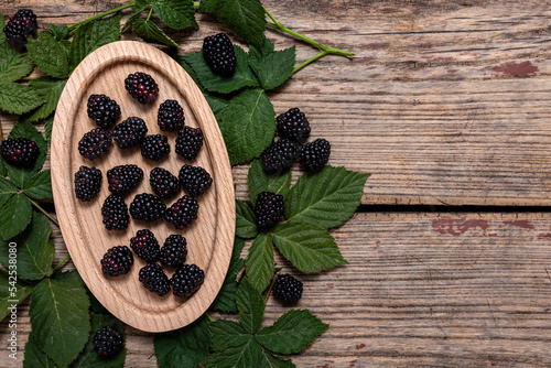 Fototapeta Naklejka Na Ścianę i Meble -  Blackberries on a old wooden table