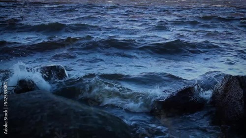 blue waves beat against coastal stones, boulders, ocean, sea, lake, river