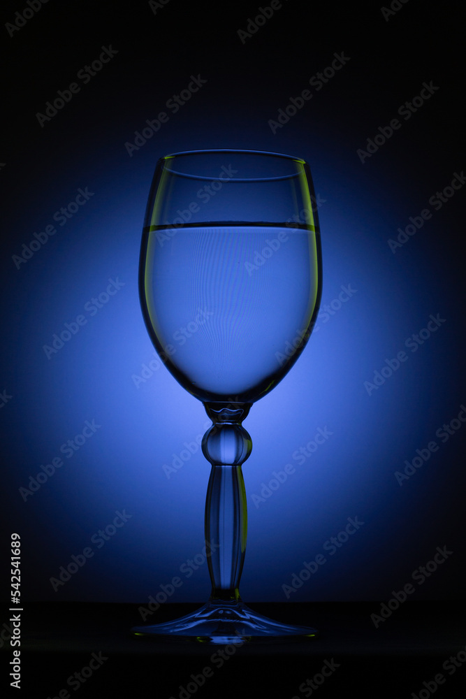 a glass on a black background with light a glass on a black background with light