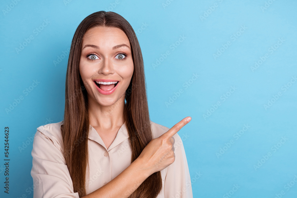 Close up photo of pretty lady offer index mall banner discount low price empty space fashionable clothes isolated on blue color background Close up photo of pretty lady offer index mall banner discount low price empty space fashionable clothes isolated on blue color background
