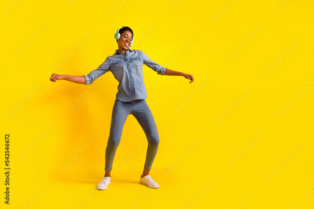 Full length portrait of cheerful satisfied person enjoy free time chilling isolated on yellow color background