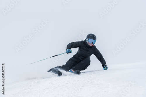 Young blonde woman skiing on a sunny day
