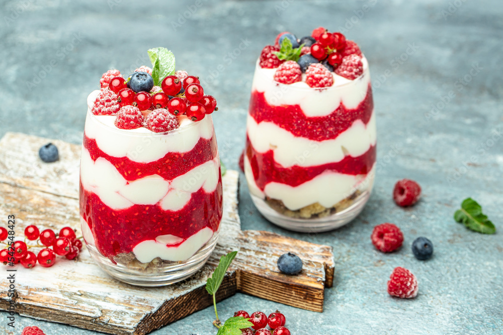 Cranachan raspberry dessert in jar on a light background. Long banner format Cranachan raspberry dessert in jar on a light background. Long banner format