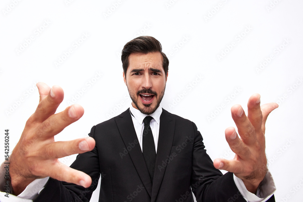 Portrait of a man in an expensive business suit close-up wide-angle lens pulls his hands into the camera with open mouth surprise happiness smile with teeth on a white background, copy space Portrait of a man in an expensive business suit close-up wide-angle lens pulls his hands into the camera with open mouth surprise happiness smile with teeth on a white background, copy space