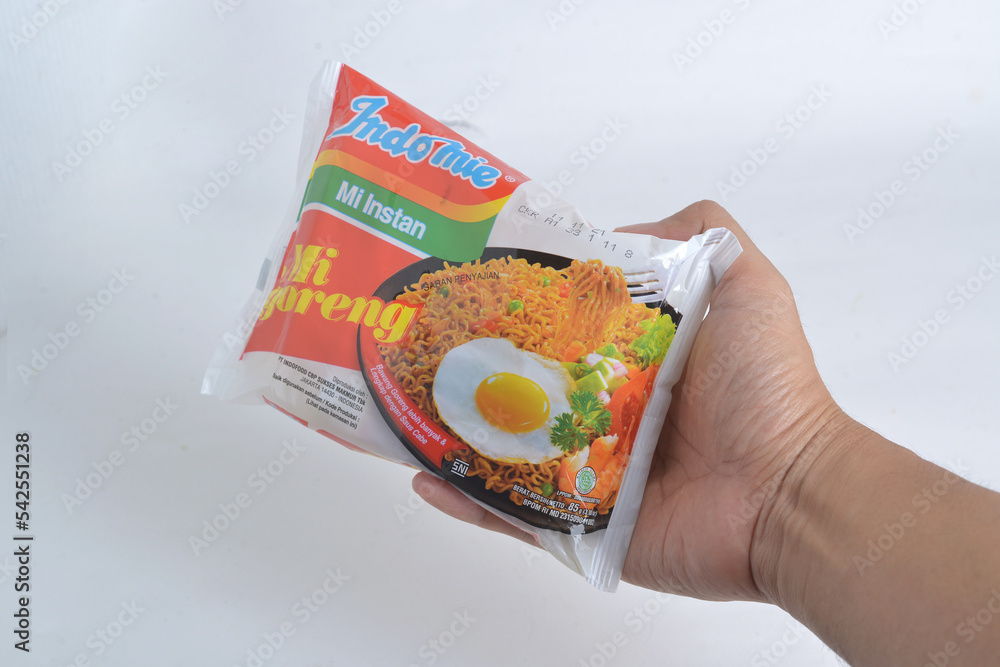 Hand holding Indomie, Mie Instant, Instant Noodle, Mie Goreng, Instant