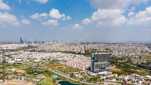 Image of Puebla, Mexico during sunrise. Panoramic aerial view of the cities of Puebla and Angelopolis.