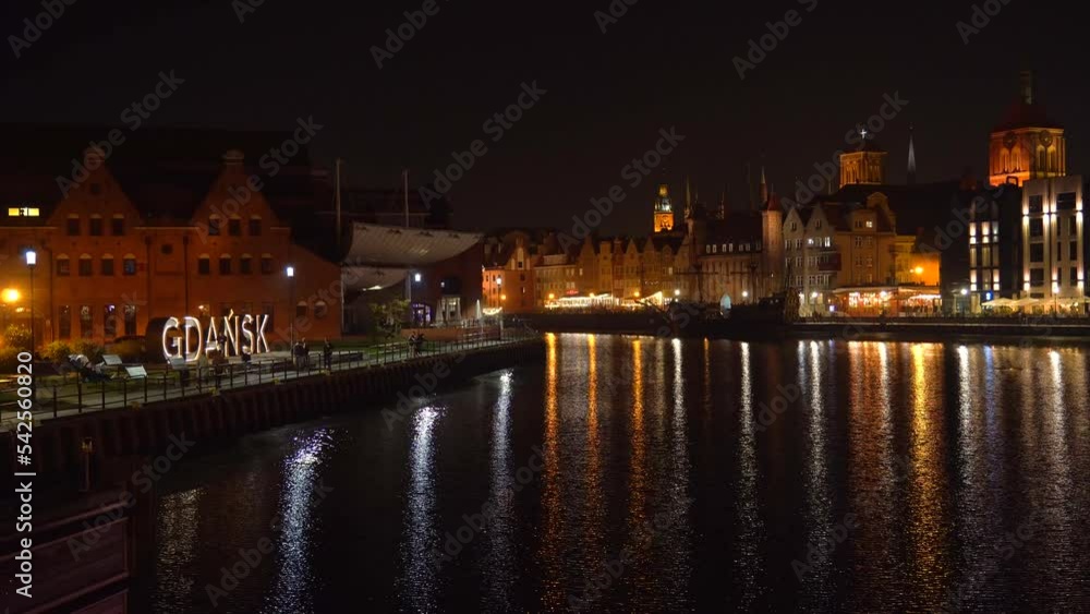 Gdansk, Poland night city view. Night embankment of the old city night illumination. Gdansk, Poland night city view. Night embankment of the old city night illumination.