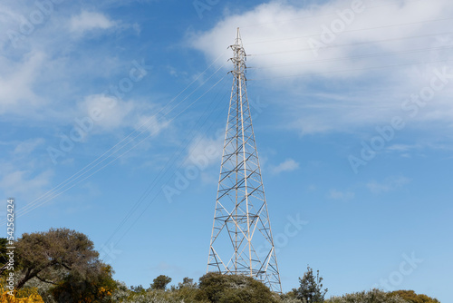 Electricity tower and power lines on the coast