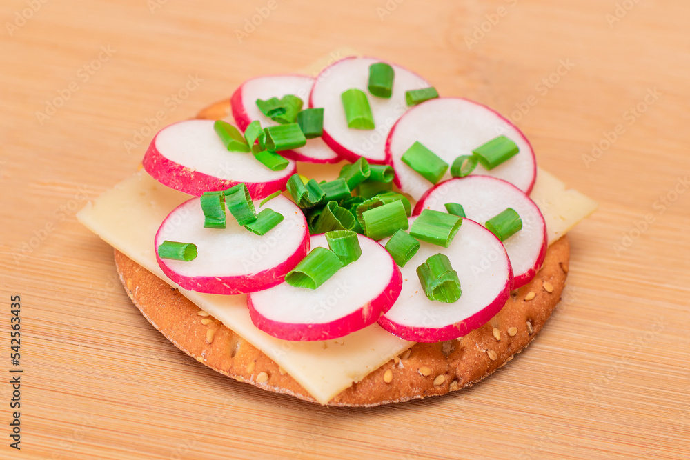 Crispy Cracker Sandwich with Radish, Cheese and Green Onions on Cutting Board. Easy Breakfast. Diet Food. Quick and Healthy Sandwiches. Crispbread with Tasty Filling. Healthy Dietary Snack Crispy Cracker Sandwich with Radish, Cheese and Green Onions on Cutting Board. Easy Breakfast. Diet Food. Quick and Healthy Sandwiches. Crispbread with Tasty Filling. Healthy Dietary Snack