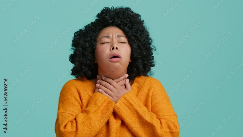 Unhealthy young African American woman suffering from angina, sore