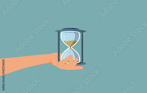 Hand Holding an Hourglass Vector Conceptual Illustration. Person with sandglass counting the minutes for a project deadline
