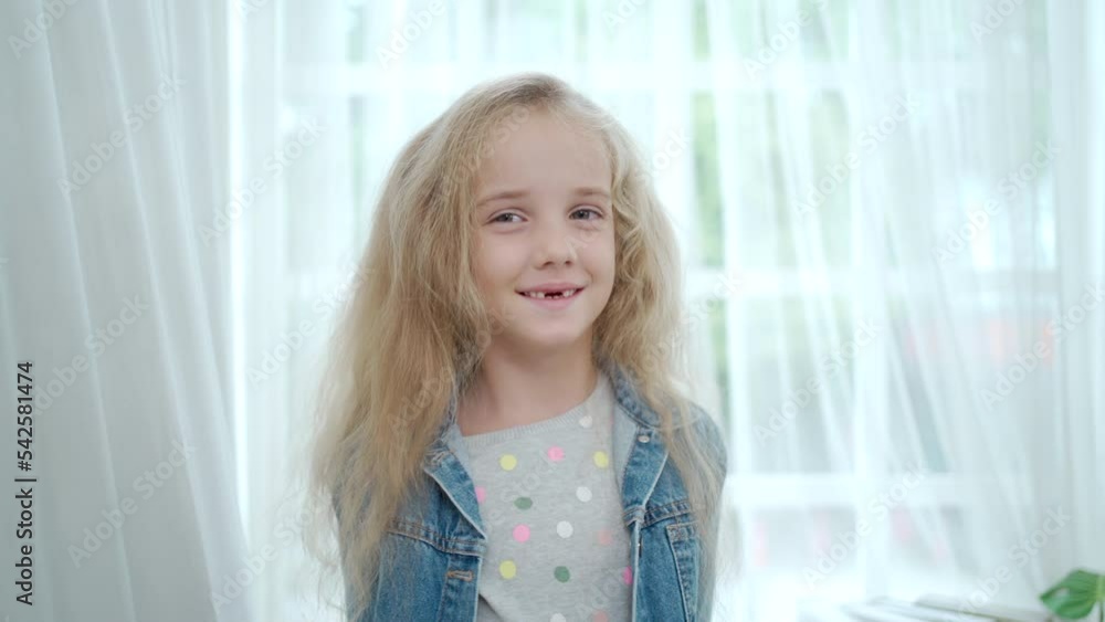 Happy caucasian girl smiling and showing thumb up to camera. Happy caucasian girl smiling and showing thumb up to camera.