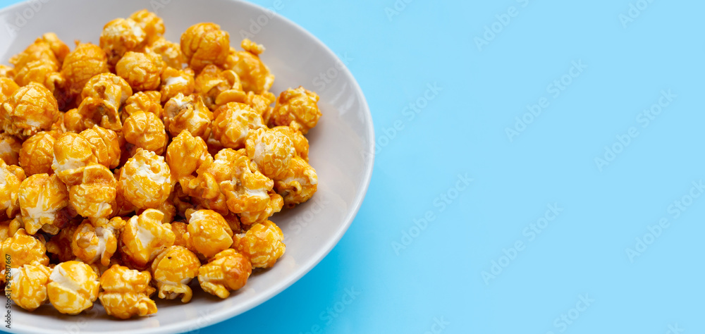 Honey caramel popcorn on white background. Honey caramel popcorn on white background.