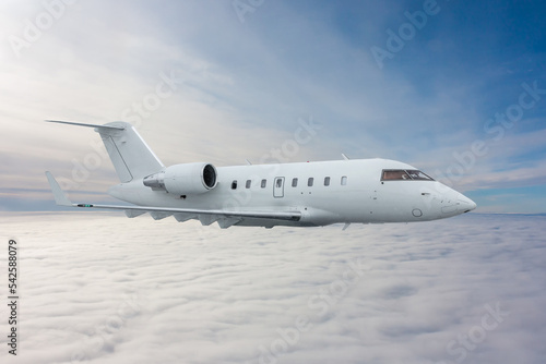 White private jet fly in the air above the clouds