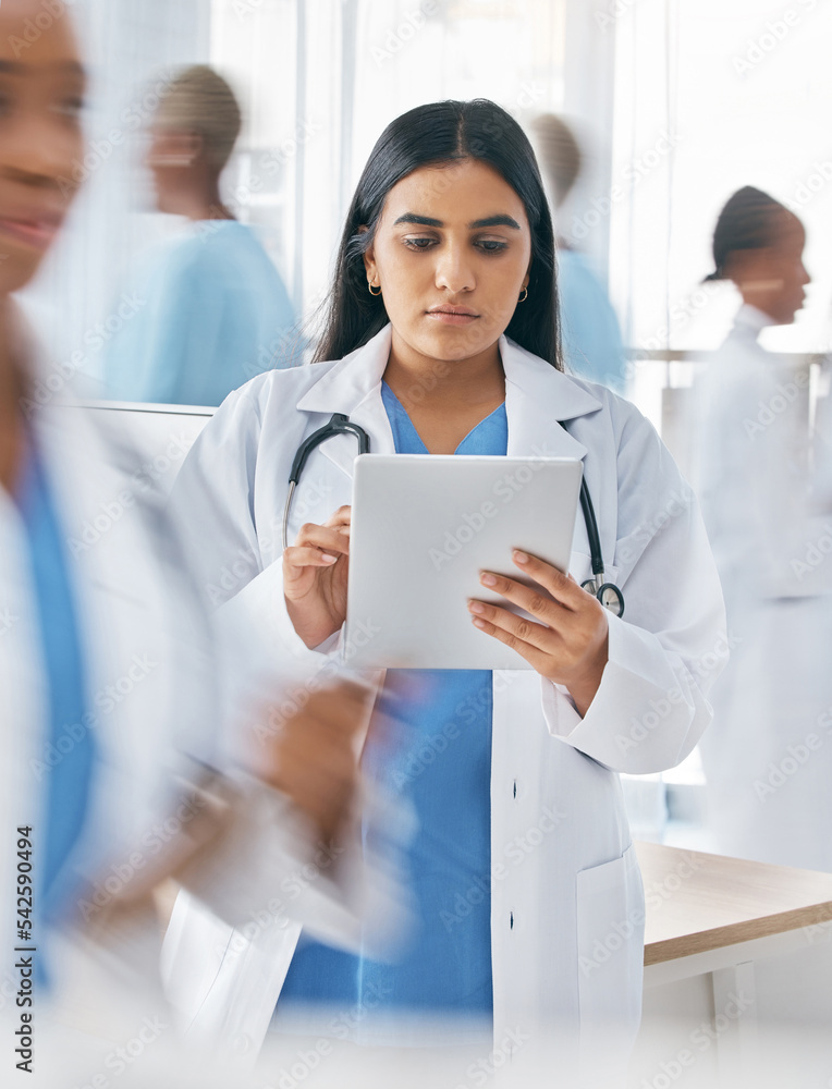 Doctor, tablet and busy hospital with internet research, online schedule and digital calendar at work. Medical worker working in healthcare clinic planning with digital tech to check patient records